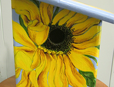 koristemaalaus - auringonkukkia linnunpöntössä